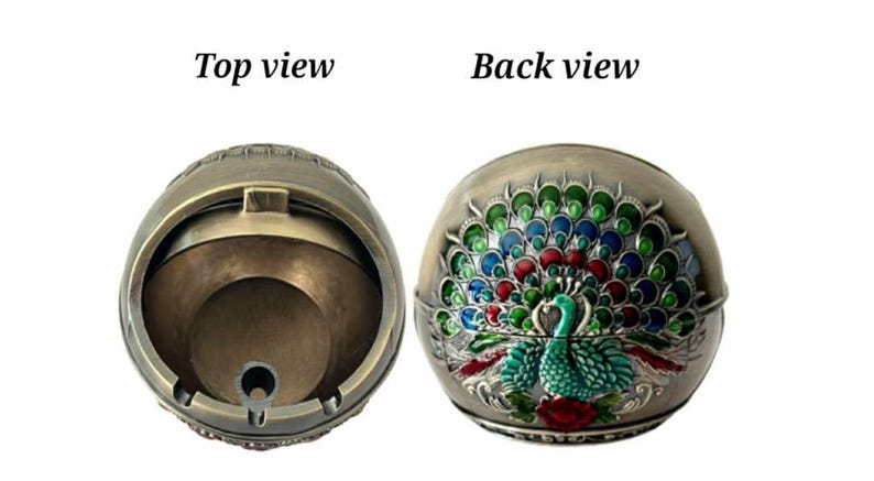 May include: A decorative ashtray with a peacock design. The front view shows a detailed peacock with a fanned tail in shades of green, blue, and red. The top view shows the inside of the ashtray. The text "Top view" and "Back view" are visible.