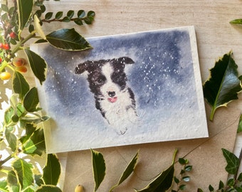 Border collie puppy in snow Christmas card