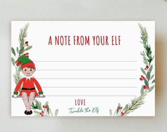 May include: A white card with the text "A NOTE FROM YOUR ELF" in red. An illustration of an elf in a red and green outfit is on the left. The card is decorated with green leaves and red berries.