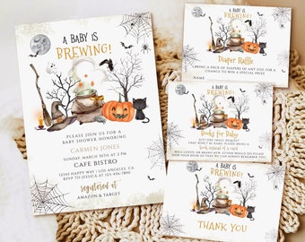 May include: A set of printed paper baby shower stationery featuring a Halloween theme with a cauldron, pumpkin, black cat, and spiderwebs. The text reads A BABY IS BREWING, DIAPER RAFFLE, BOOKS FOR BABY, and THANK YOU, with event details included.