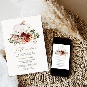 May include: Bridal shower invitation featuring a watercolor white pumpkin and floral arrangement in shades of pink, burgundy, and green. The invitation text reads "Fall in love" and includes event details and RSVP information.