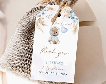 May include: A white thank you tag with blue and brown watercolor illustrations of a teddy bear holding a blue balloon, pampas grass, and flowers. The text reads "We Bearly Wait" and "Thank You Jessica's Baby Shower October 21st, 20XX".