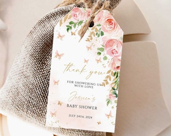 May include: Pink and gold baby shower favor tag with butterflies and floral design. The tag says "Thank you for showering us with love Jessica's Baby Shower July 24th, 2024".