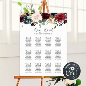 Puede incluir: Un plano de asientos de boda con un diseño floral en tonos burdeos, rosa y azul. El plano enumera las mesas del 1 al 12 con los nombres de los invitados. El texto de la parte superior dice "Amy. Brad 9.24.2020 LOS ANGELES".