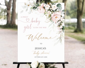 May include: A white welcome sign with pink and green floral watercolor design. The text reads "A sweet baby girl is on the way. Welcome to Jessica's baby shower. October 21st, 20XX".