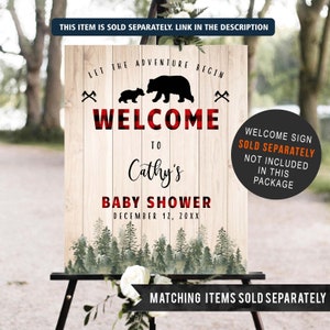 May include: Welcome sign for a baby shower with a red and black buffalo plaid background. The sign features a silhouette of a mama bear and a baby bear with the text "Let the adventure begin" and "Welcome to Cathy's Baby Shower" with the date "December 12, 20XX".