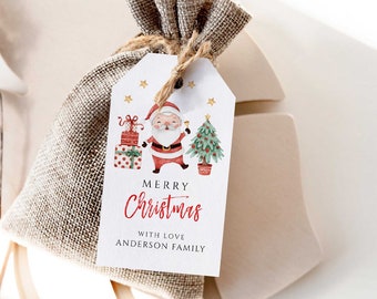 May include: A Christmas gift tag with a watercolor illustration of Santa Claus, a Christmas tree, and wrapped presents. The tag is white with the words "MERRY Christmas" in red script and "WITH LOVE ANDERSON FAMILY". The tag is attached to a burlap bag.