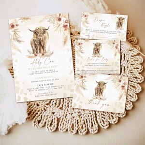 May include: A baby shower invitation with a watercolor illustration of a Highland cow and calf. The invitation is decorated with floral elements and a beige and brown background. The text reads "Holy Cow! We're having a baby!" and includes details about the shower, including the date, time, location, and RSVP information.