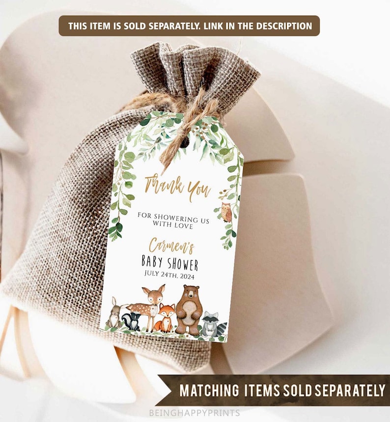 May include: A white thank you tag with green foliage and woodland animals. The text reads "Thank You for showering us with love Carmen's Baby Shower July 24th, 2024".