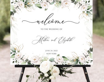 May include: White wedding welcome sign with green foliage and white flowers. The sign says "Welcome to the wedding of Matthew and Elizabeth, June 24, 2022, New York."