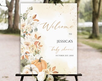 Könnte beinhalten: Willkommensschild für eine Babyparty mit floralem und Kürbis-Design. Auf dem Schild steht "Willkommen zu Jessicas Babyparty" und das Datum 21. Oktober 20XX. Das Schild wird auf einer schwarzen Staffelei angezeigt.