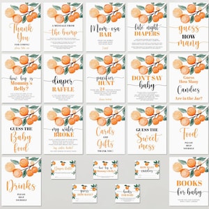 May include: A collection of baby shower game signs with orange and green watercolor illustrations. The signs feature phrases like "Thank You," "Mom-osa Bar," and "Guess How Many Candies." The signs are on a white background.