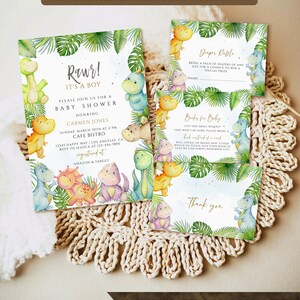 May include: A baby shower invitation with a jungle theme. The invitation features a green, yellow, and blue dinosaur with the text "Rawr! It's a boy" and "Please join us for a baby shower honoring Carmen Jones".
