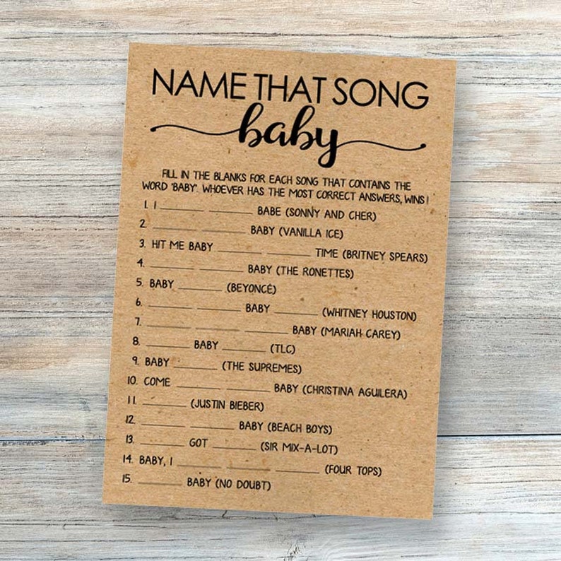 Puede incluir: Una tarjeta de papel marr&oacute;n con un juego llamado "Name That Song Baby". El juego tiene 15 preguntas, cada una con un espacio en blanco para que el jugador complete la palabra que falta "baby" de un t&iacute;tulo de canci&oacute;n. El juego est&aacute; dise&ntilde;ado para un baby shower.