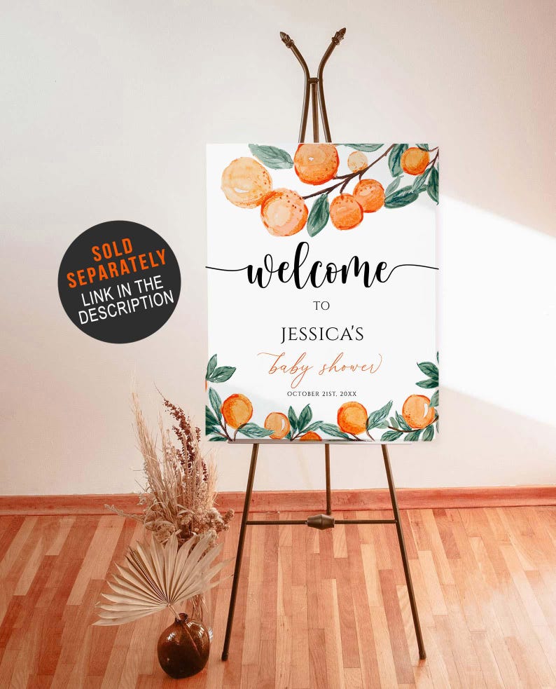 May include: A welcome sign for Jessica's baby shower, featuring orange watercolor illustrations and the text "welcome to Jessica's baby shower October 21st, 20XX". The sign is displayed on a dark brown easel.