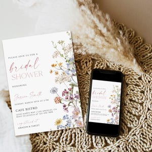 May include: A white bridal shower invitation with pink and blue floral accents. The invitation includes the text "Please join us for a bridal shower honoring Jessica Smith" and details about the event, including the date, time, location, and RSVP information. The invitation also includes the text "registered at Amazon & Target".