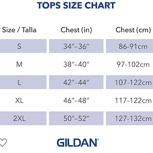 May include: A size chart for tops with measurements in inches and centimetres. The chart shows sizes S, M, L, XL, and 2XL with corresponding chest measurements.