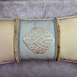Teal and Champagne Color Embroidery Lumbar Custom Pillow with tape and trim brush
