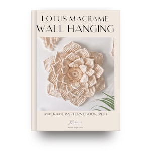 May include: A book cover featuring a beige macrame lotus flower wall hanging. The text reads "LOTUS MACRAME WALL HANGING" and "MACRAME PATTERN EBOOK (PDF)". The design includes a detailed, textured lotus flower.