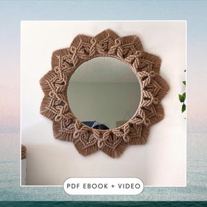 May include: A circular mirror with a macrame frame. The frame is made of tan-coloured knotted rope, creating a sunburst pattern. The text "PDF EBOOK + VIDEO" is at the bottom of the image.