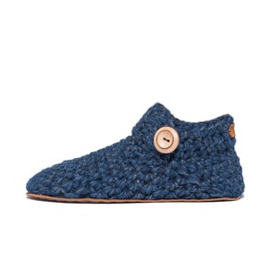 Side angle of a navy blue wool slipper with wooden button fastening and suede leather sole. Handmade by Kingdom of Wow. Barefoot design for Men and Women.