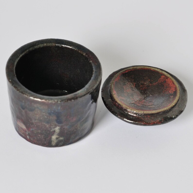 Raku pottery container with a lid. image 10