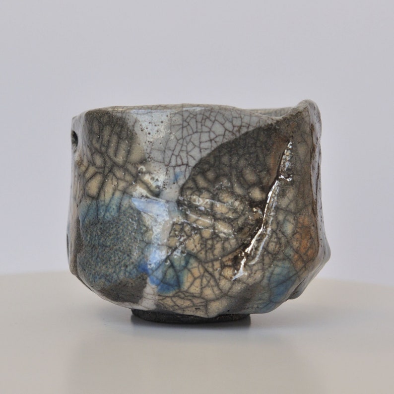 Big Asymmetric Whitegray Chawan With Azure and Light Orange Smears. A