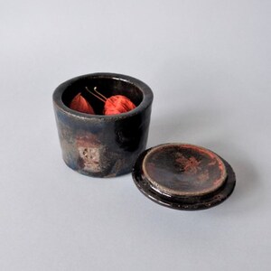 Raku pottery container with a lid. image 5