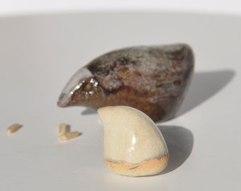 Two tiny ceramic birds figurines. Miniature bird sculptures. A couple of birdies.