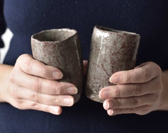 Set of two warm grays with burgundy spots cups. Raku pottery.