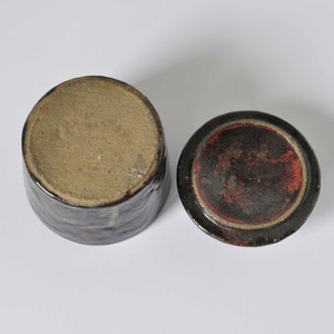 Raku pottery container with a lid. image 9