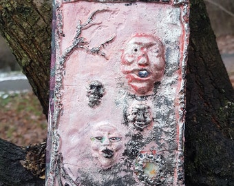 haunted book low relief on the cover