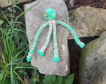 Skinny green alien , ugly and cute