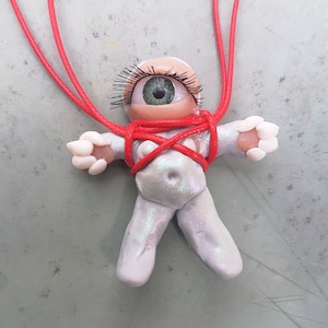 Eccentric Elegance: Embrace the Sweet and Strange Alien Necklace,beautiful and old