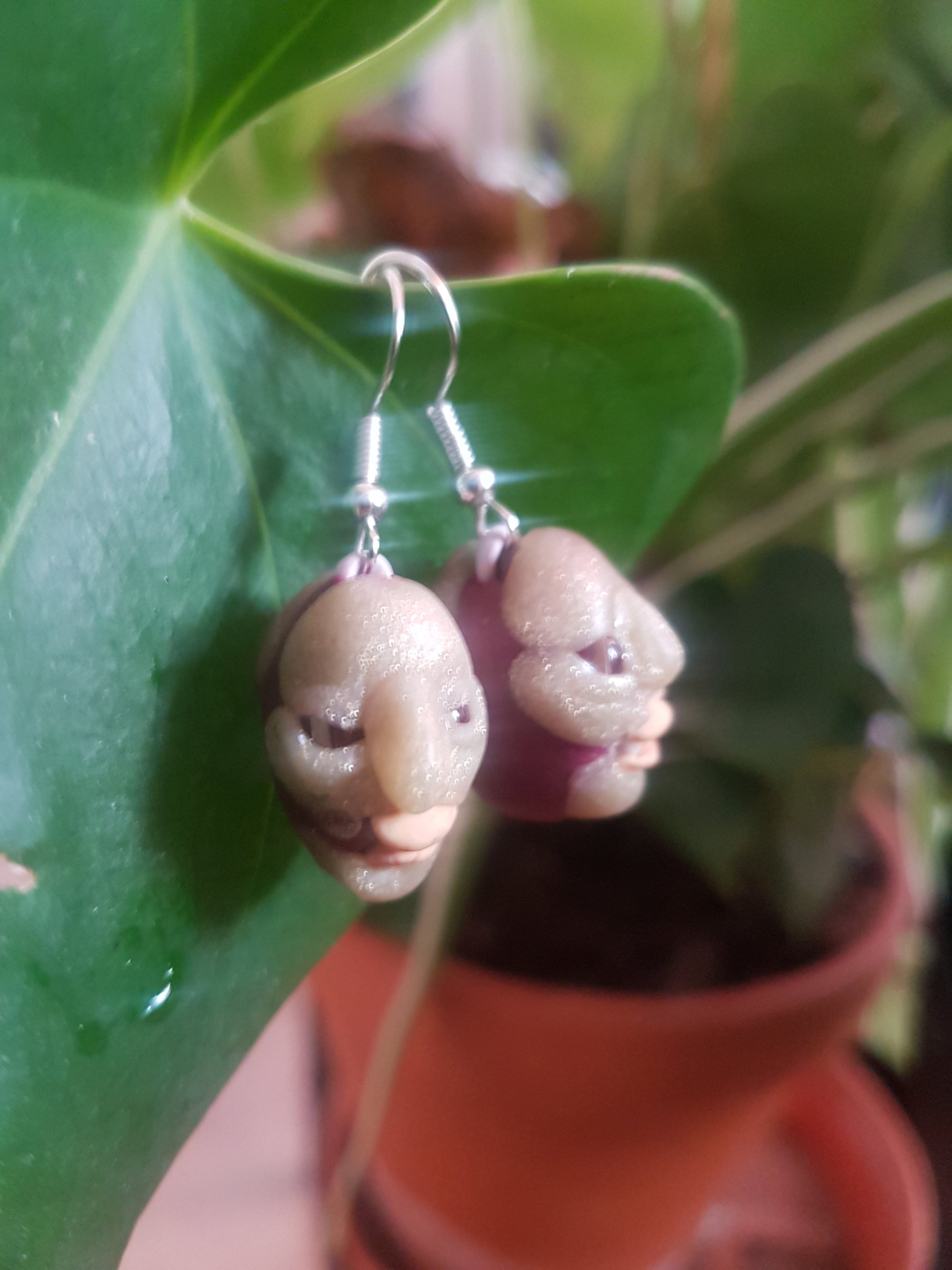 disturbing doll heads earrings ,ugly and cute