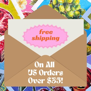 May include: A brown envelope with a white card featuring the words "free shipping" in a pink oval. The card is surrounded by colorful fruit paintings. The text "On All US Orders" is also visible.