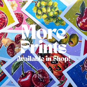 May include: A collection of colorful art prints featuring various fruits and vegetables, including cherries, grapes, and apples. The prints are displayed on a white background with the text "More Prints Available in Shop!"