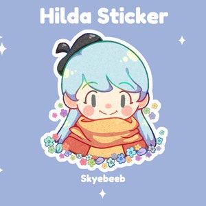 May include: A die-cut sticker featuring a cartoon character with light blue hair, a black beret, and a yellow scarf, surrounded by small colorful flowers. The text Hilda Sticker and Skyebeeb is printed in white against a light blue background.