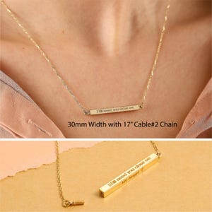 May include: Gold bar necklace with the inscription "Still need you close to" and "My Angel T". The necklace is 17 inches long and has a cable chain.