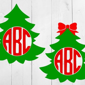 May include: Two green Christmas tree silhouettes with red bows and a red circle with the letters ABC inside.