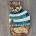 Cat in striped sweater