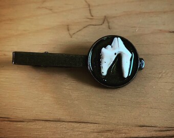 Raccoon tooth tie bar