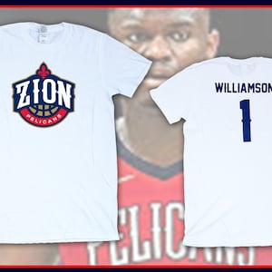 May include: Two white t-shirts, one with the New Orleans Pelicans logo and the text "Zion Pelicans" and the other with the text "Williamson 1" in blue.
