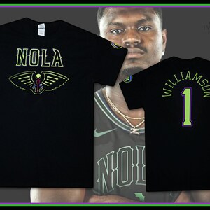 May include: Two black t-shirts with green and yellow text. One shirt says "NOLA" with a pelican graphic. The other shirt says "Williamson 1".