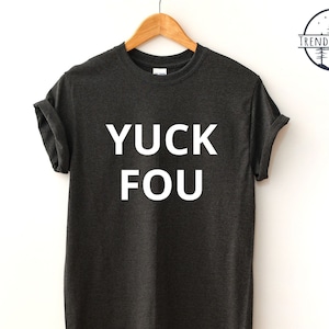 May include: Dark grey heather t-shirt with the text "YUCK FOU" printed in white.