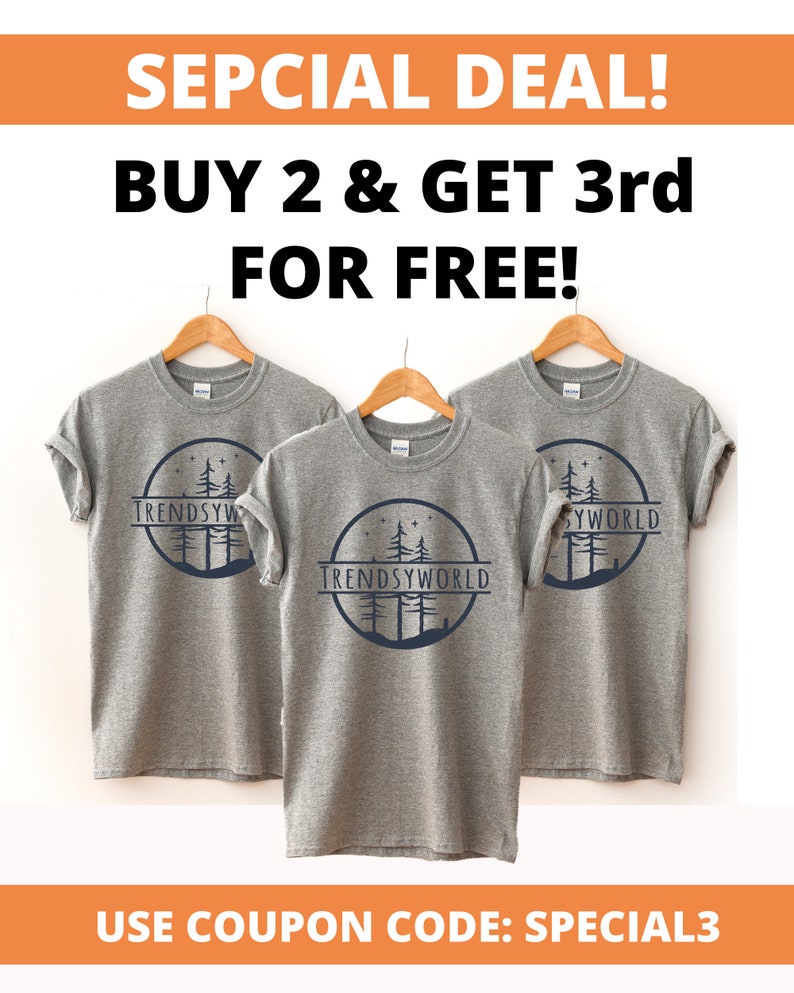 May include: Three gray t-shirts with a forest scene and the text "TRENDSYWORLD" printed on the front. The image includes the text "SEPCIAL DEAL! BUY 2 & GET 3rd FOR FREE!" and "USE COUPON CODE: SPECIAL3".