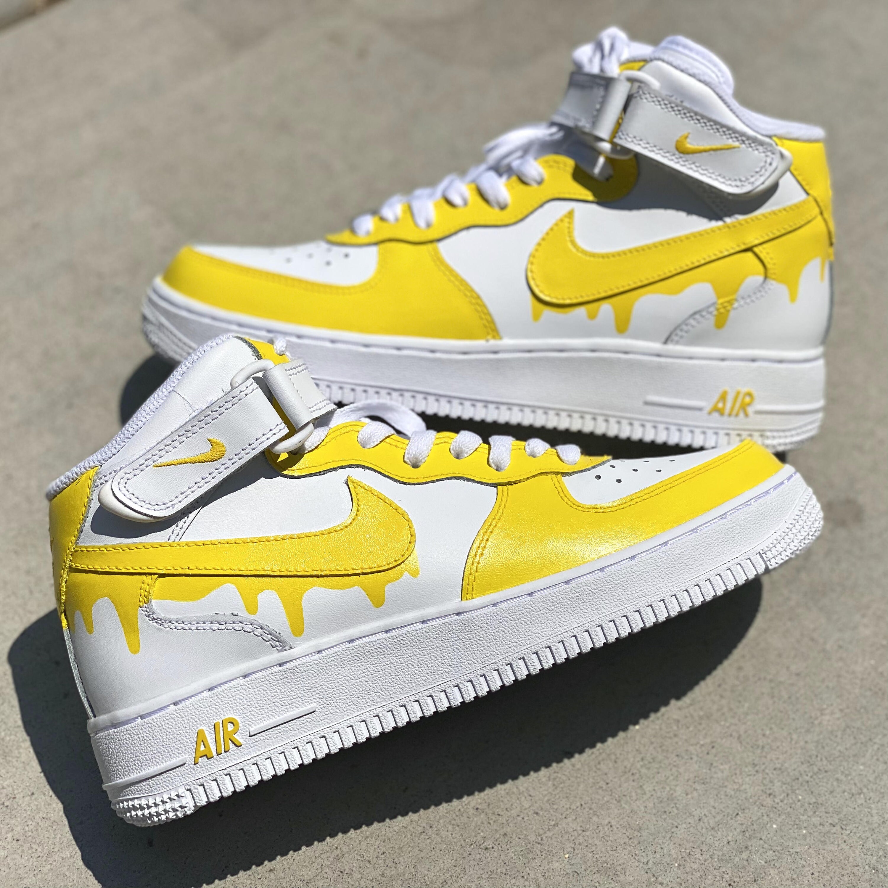 nike air force ones with yellow swoosh