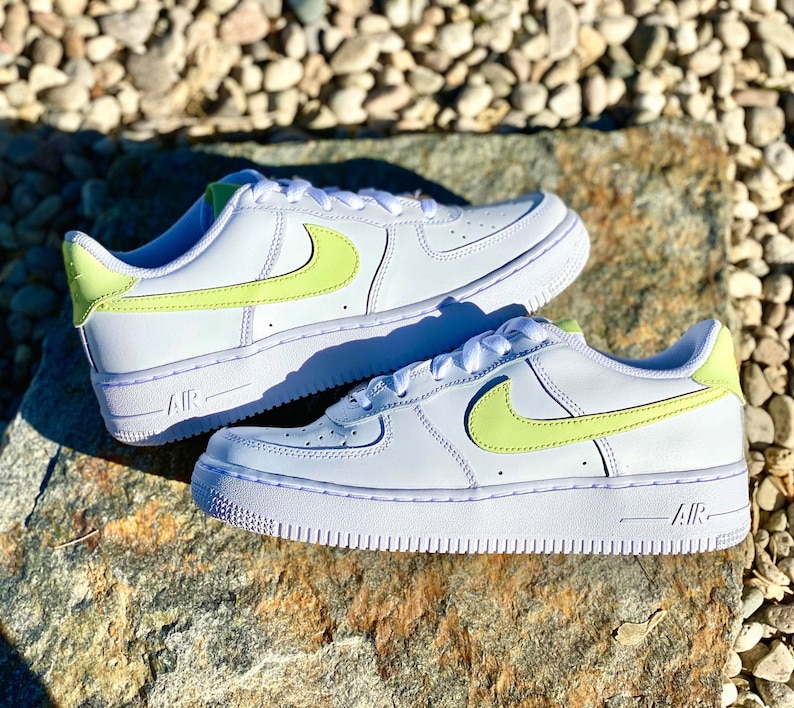 nike shoes with different color swoosh