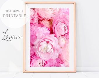 May include: A close-up image of a bouquet of pink ranunculus flowers. The flowers are arranged in a tight cluster, with the petals overlapping and creating a soft, romantic look.