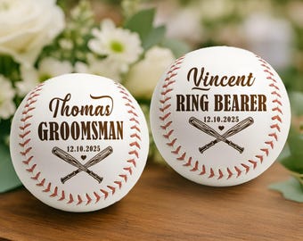 May include: Two white baseballs with red stitching and personalized text. One says "Thomas GROOMSMAN" and the other says "Vincent RING BEARER". Both have crossed bats and the date 12.10.2025.